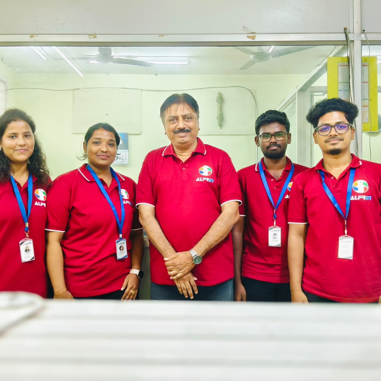 ALFRIN Technologies employees discussing work